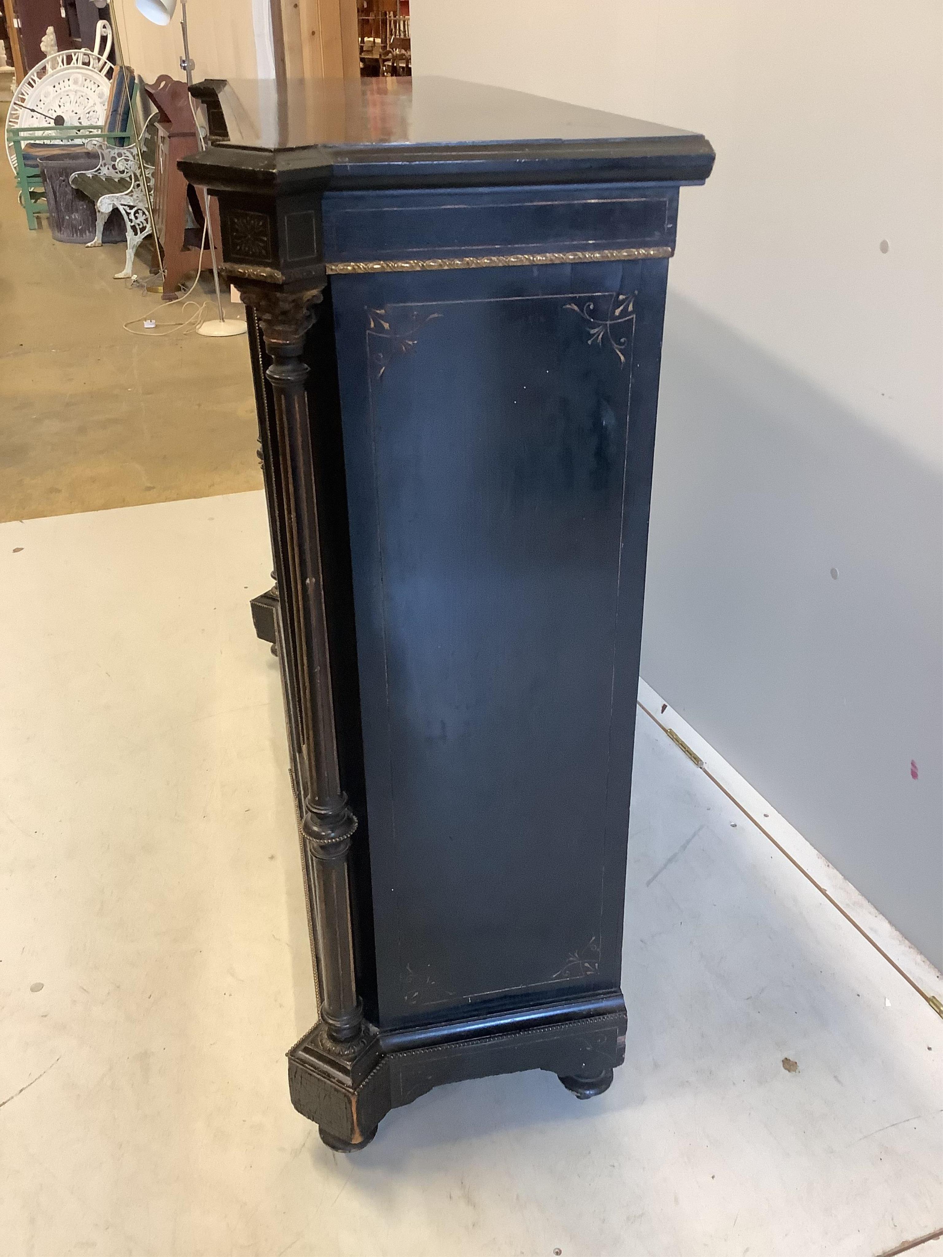 A late Victorian gilt metal mounted ebonised pier cabinet, width 124cm, depth 39cm, height 106cm. Condition - fair